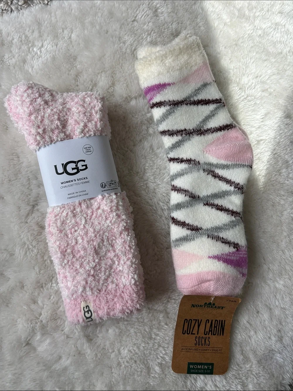 Pair of cozy socks: UGG Women's Light Pink Plush & Northeast Outfitters